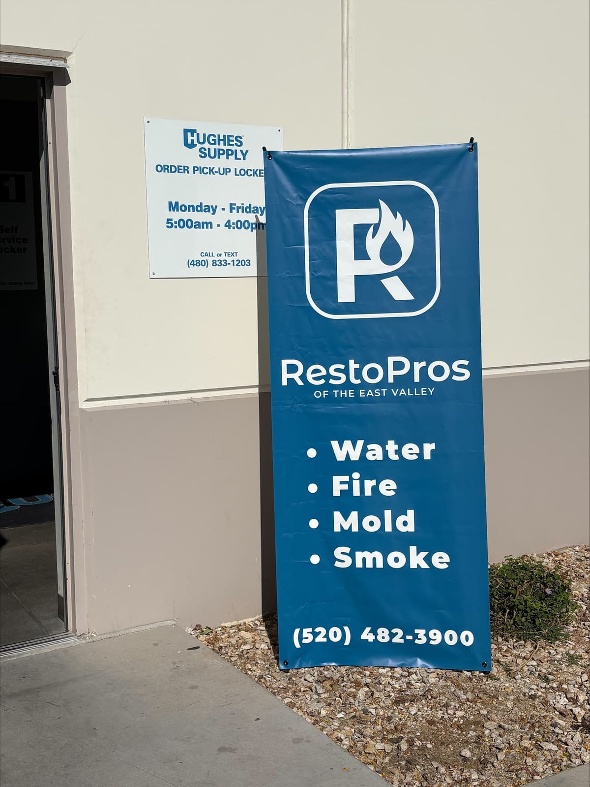 RestoPros of the East Valley outdoor banner listing water, fire, mold, and smoke services